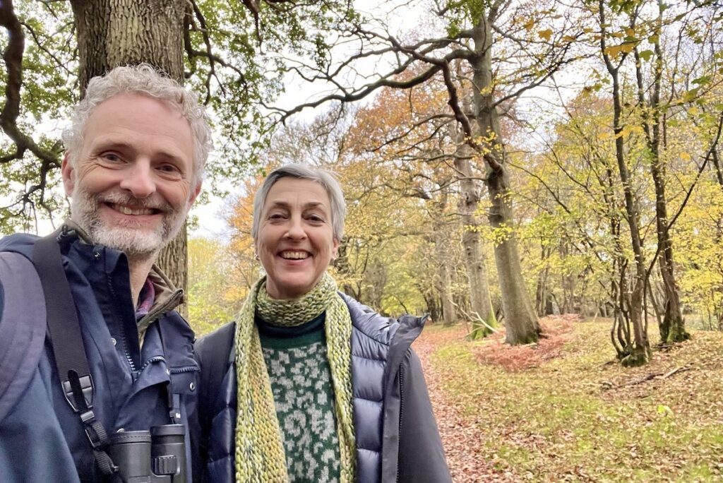 two people smiling in autumn woodland, man and woman, knepp wilding day