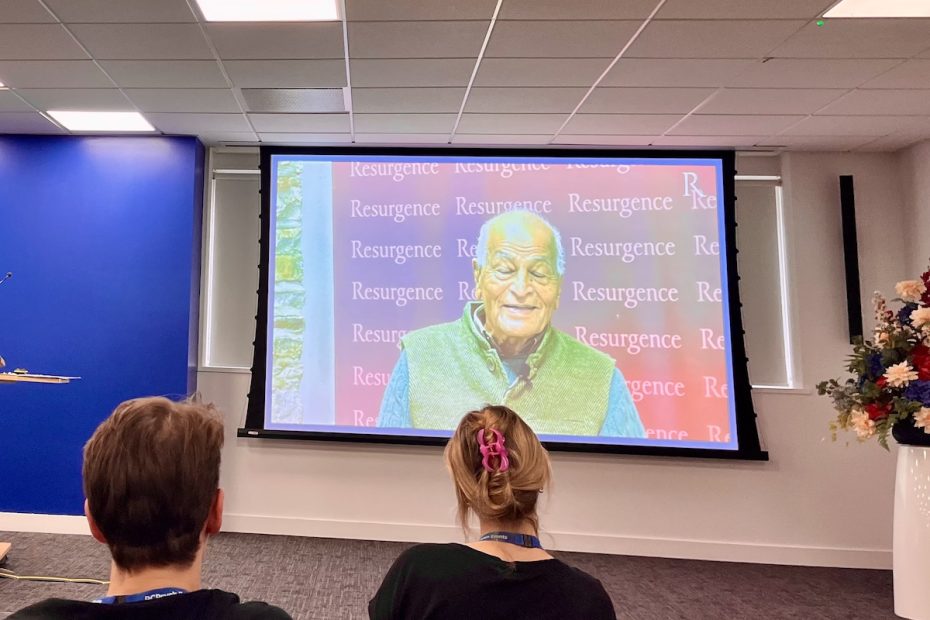 Satish Kumar on screen at conference