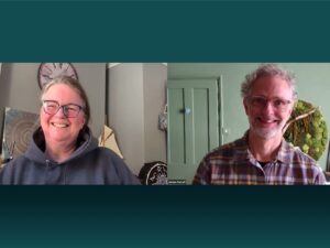 man and woman smiling on zoom meeting